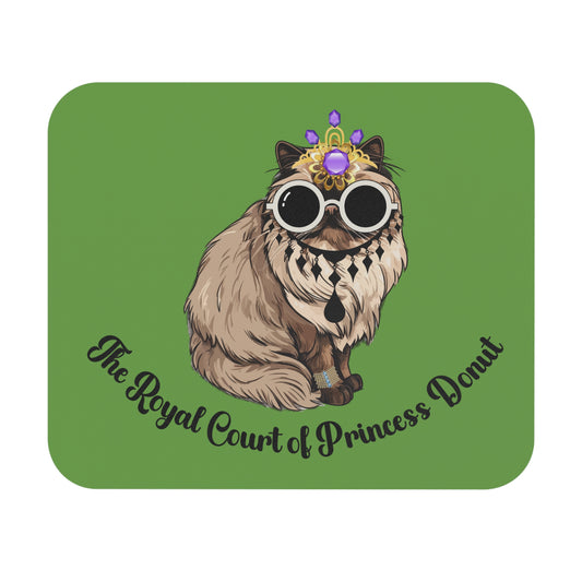 A rectangular mouse pad with a design featuring a stylized character named Carl in a royal court setting, with a green background.